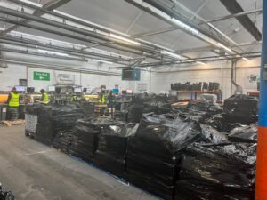 A Photo of the Concept Management Warehouse with pallets of computers